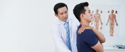 Doctor performing spine check on patient.