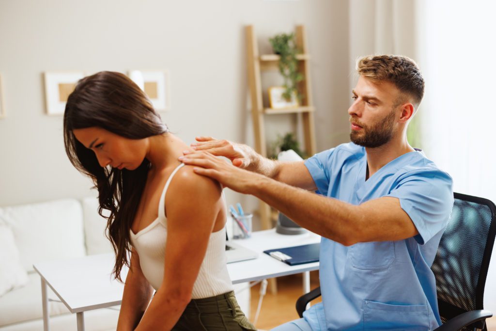 chirporactor working on a patients neck